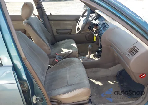 1996 Toyota Corolla from USA, damaged, VIN 2T1BA02E4TC134695